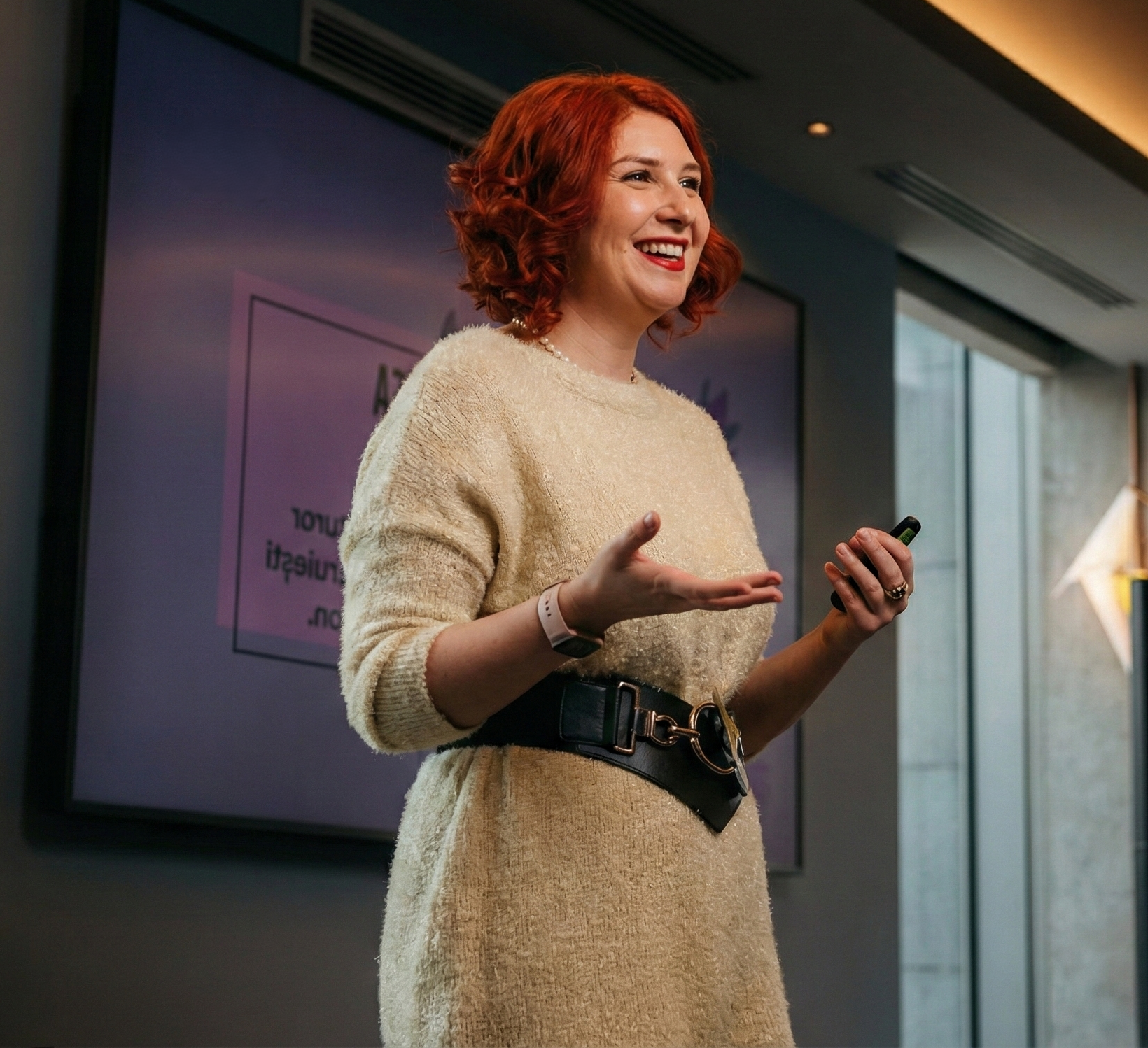 Raluca Păduraru speaking at a conference on AI strategy and foresight